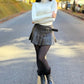 Shorts saia em courino com pregas