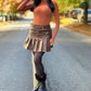 Saia shorts em courino com pregas