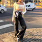 Calça wide legal em courino com lycra